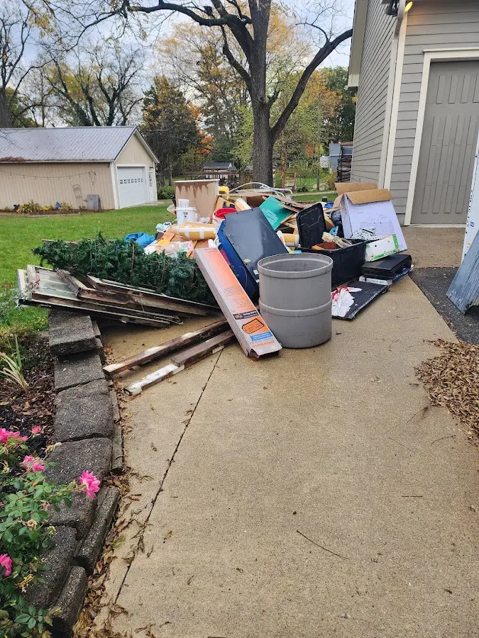Dumpster being loaded with debris for 30 Yard Dumpster Rental in Shelby